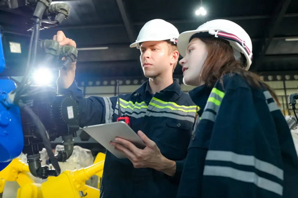 Engineers inspecting machinery at the MAV-TEC welding testing laboratory